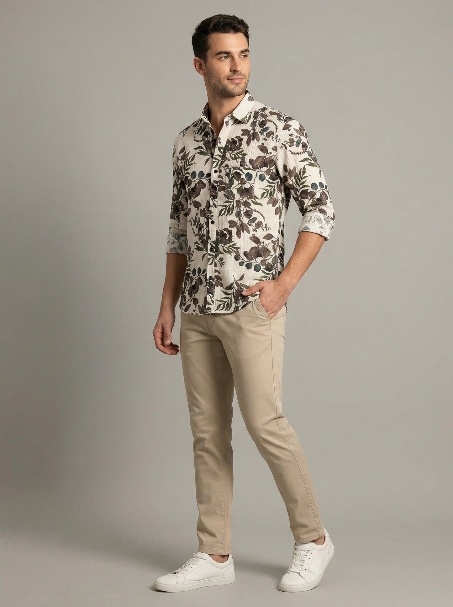 Close-up detail of the botanical leaf print and button closure