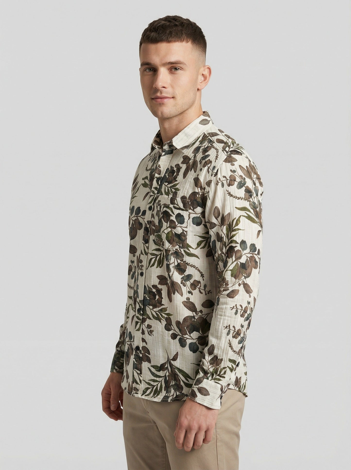 Model wearing the botanical leaf print shirt with arms crossed