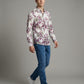 Lifestyle shot of model walking in Showane purple botanical leaf print shirt