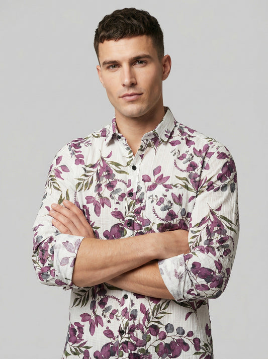 Close-up of model with arms crossed wearing Showane purple floral shirt