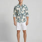 Front full view of a man wearing a Men's Botanical Print Crinkle-Texture Long Sleeve Button-Down Shirt and white linen shorts.