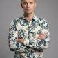 Portrait of a man with arms crossed wearing the botanical print long sleeve textured shirt.