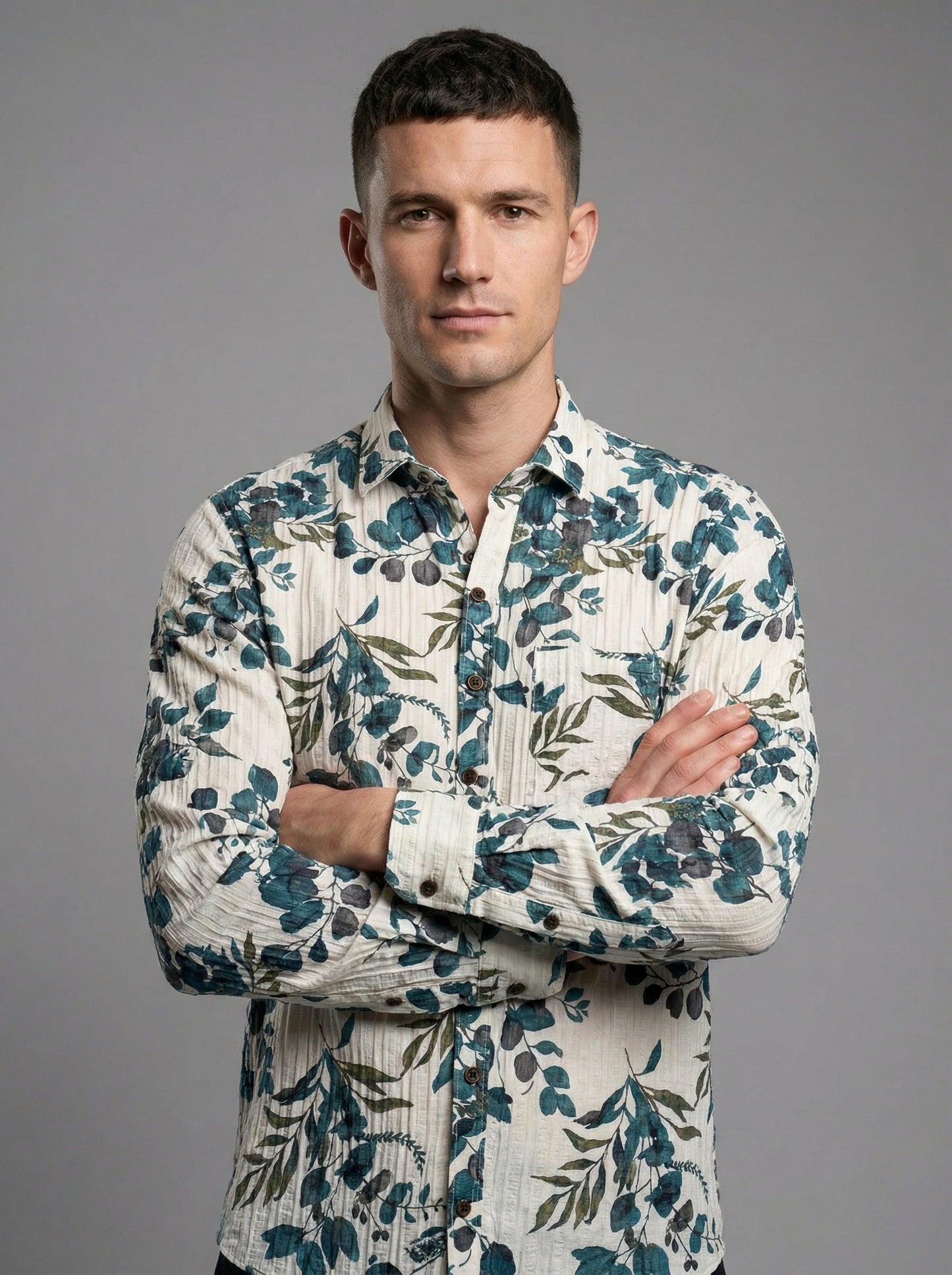 Portrait of a man with arms crossed wearing the botanical print long sleeve textured shirt.