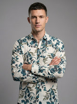 Portrait of a man with arms crossed wearing the botanical print long sleeve textured shirt.