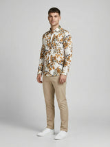Three-quarter length portrait of model wearing the Showmine Earthy Floral Seersucker Shirt