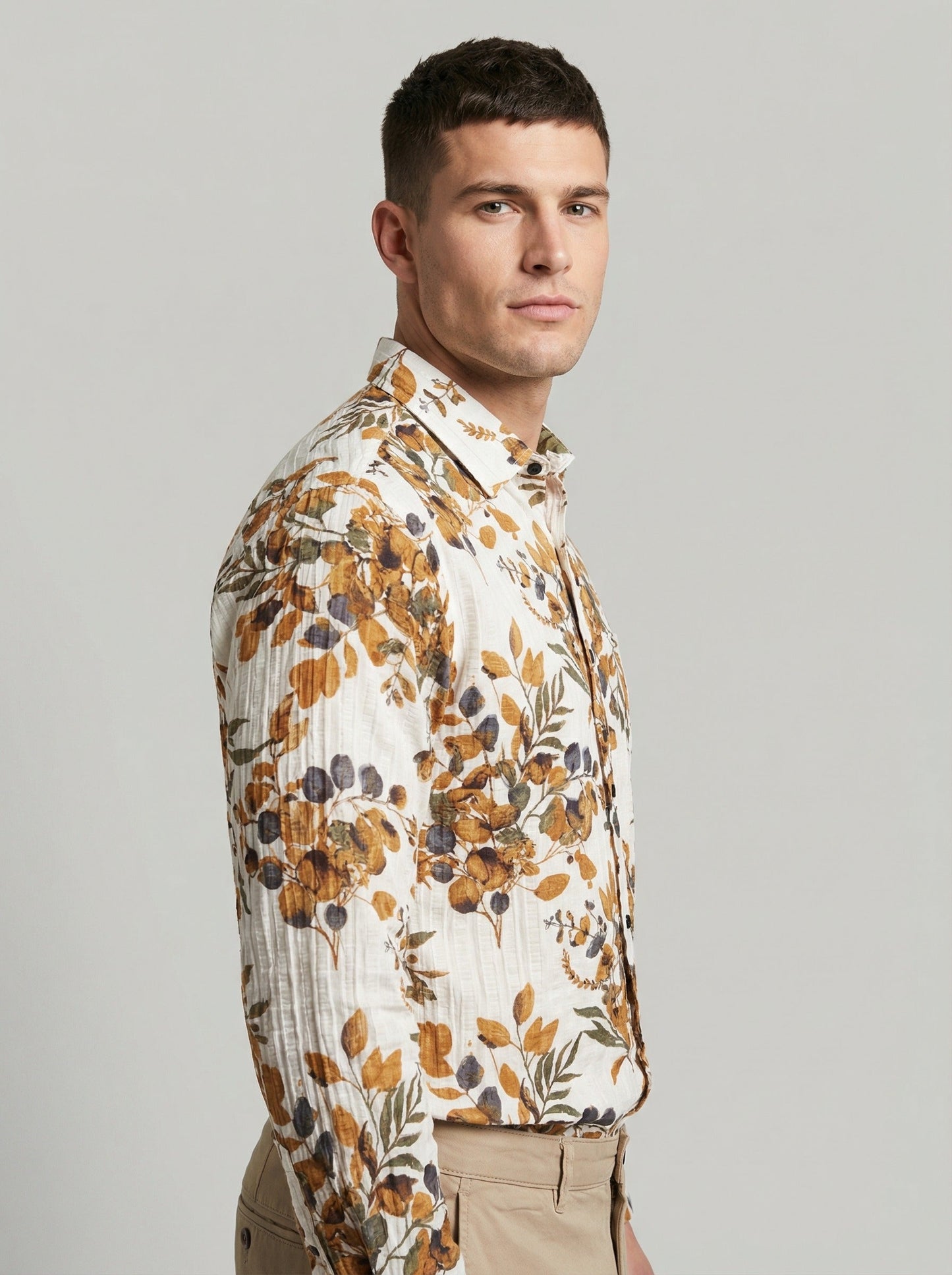 Side profile view of the floral seersucker shirt highlighting the structured collar and sleeve detail