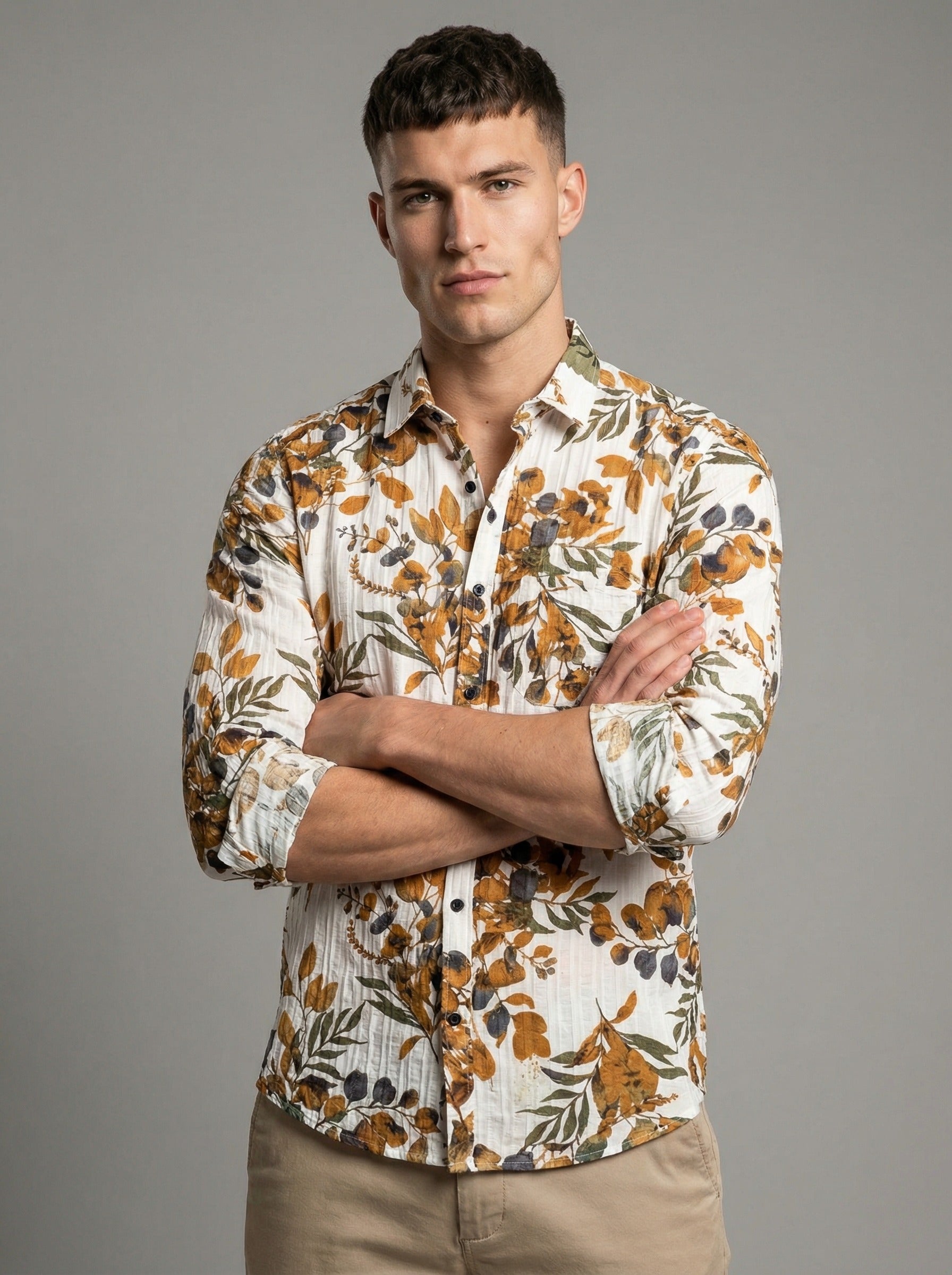 Model with arms crossed showcasing the fit and sleeve cuff of the Showmine botanical shirt