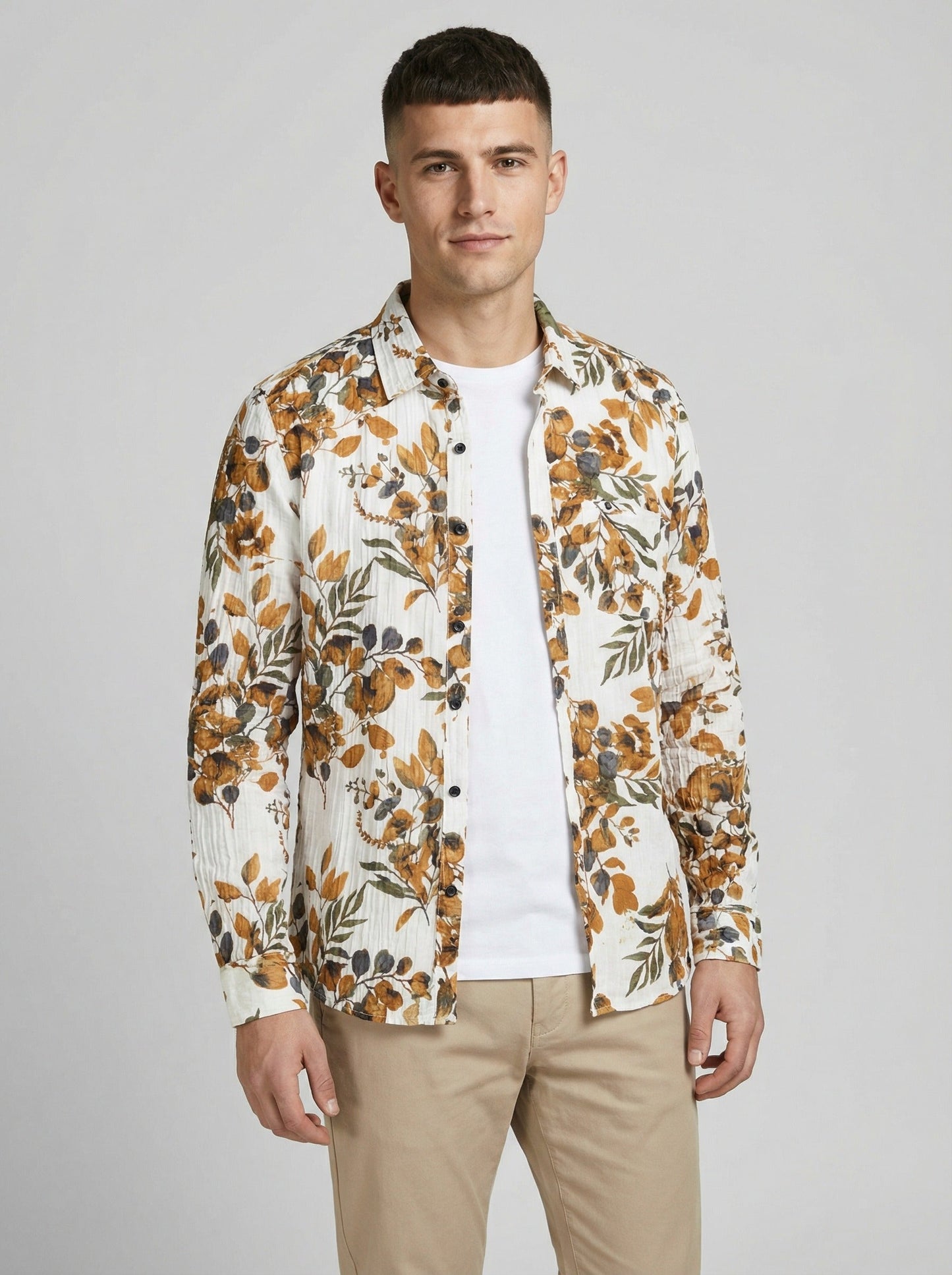 Unbuttoned styled view of the floral shirt layered over a white t-shirt