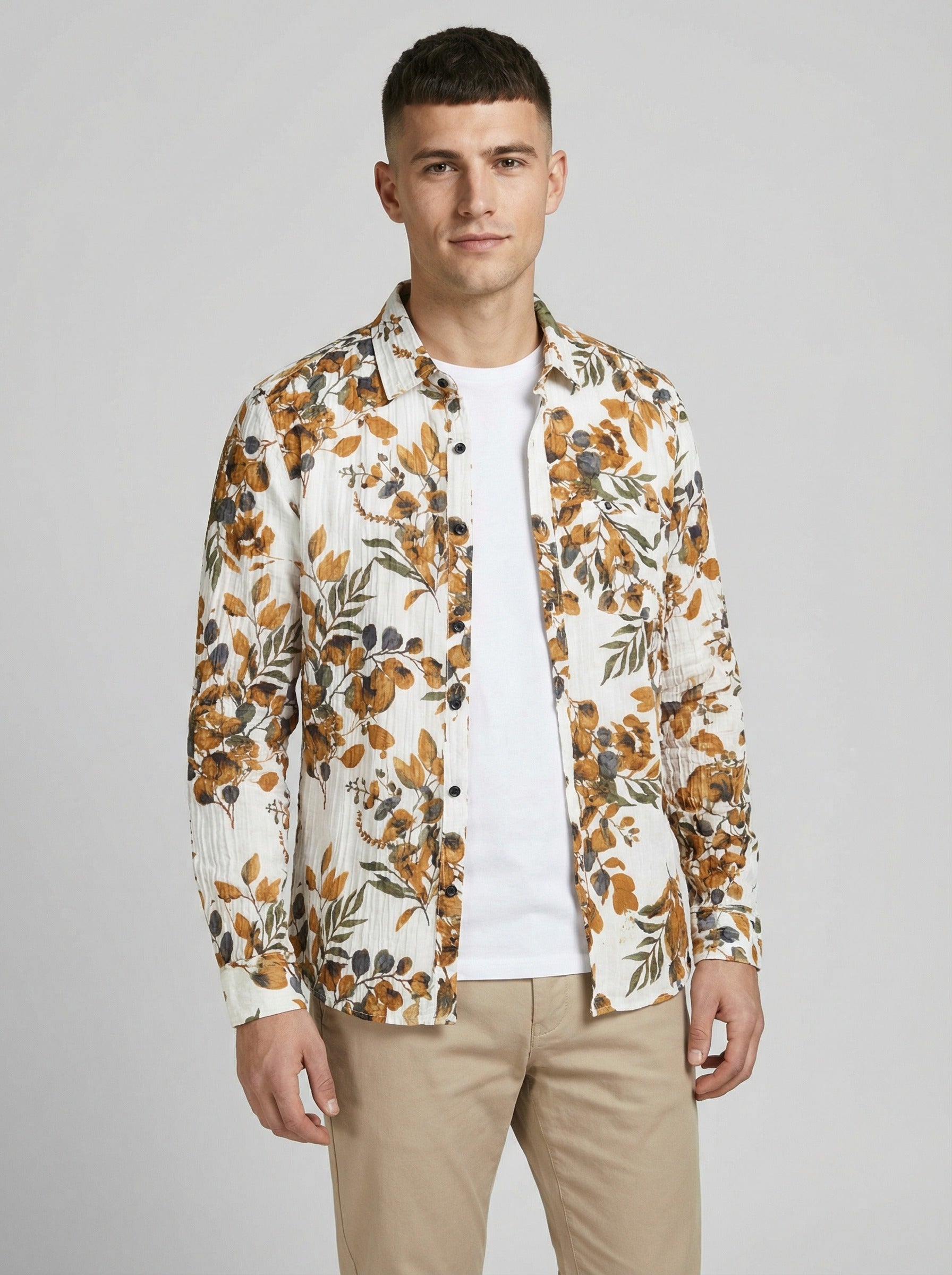 Unbuttoned styled view of the floral shirt layered over a white t-shirt