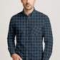 Man wearing a blue and black plaid shirt on a light gray background.
Buffalo Plaid Shirt – A Classic Button Down for Men’s Casual Style

